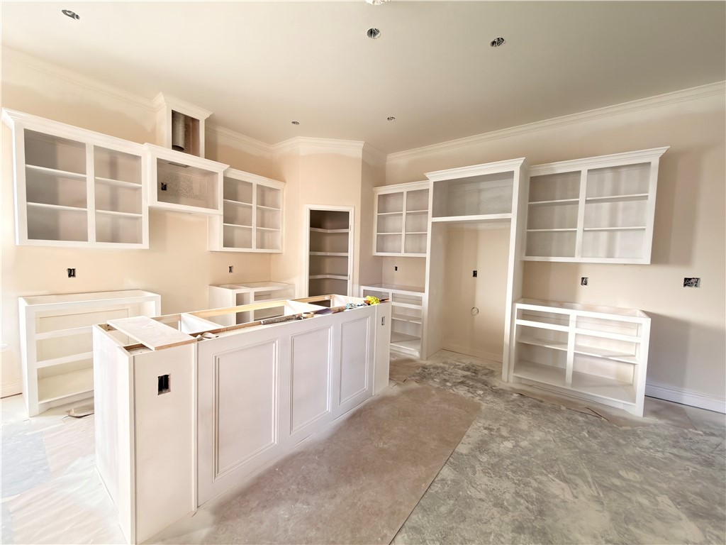 2602 Milo Street Corpus Christi, TX 78415 - Photo 4 of 14 a kitchen with a sink stove and cabinets