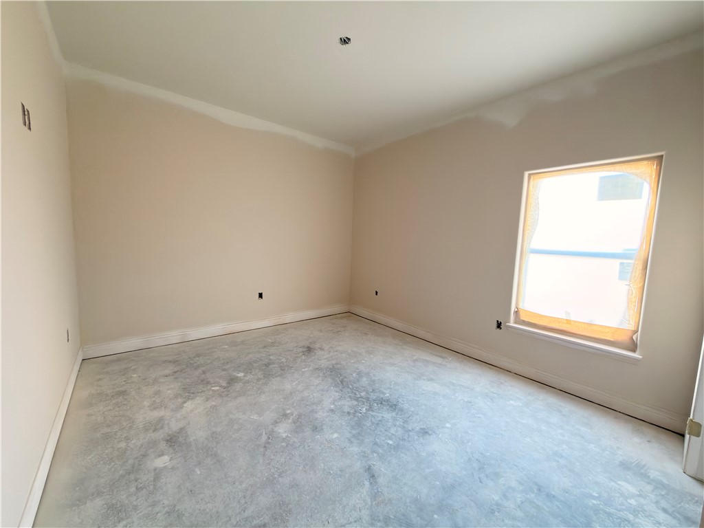 2602 Milo Street Corpus Christi, TX 78415 - Photo 9 of 14 an empty room with a window