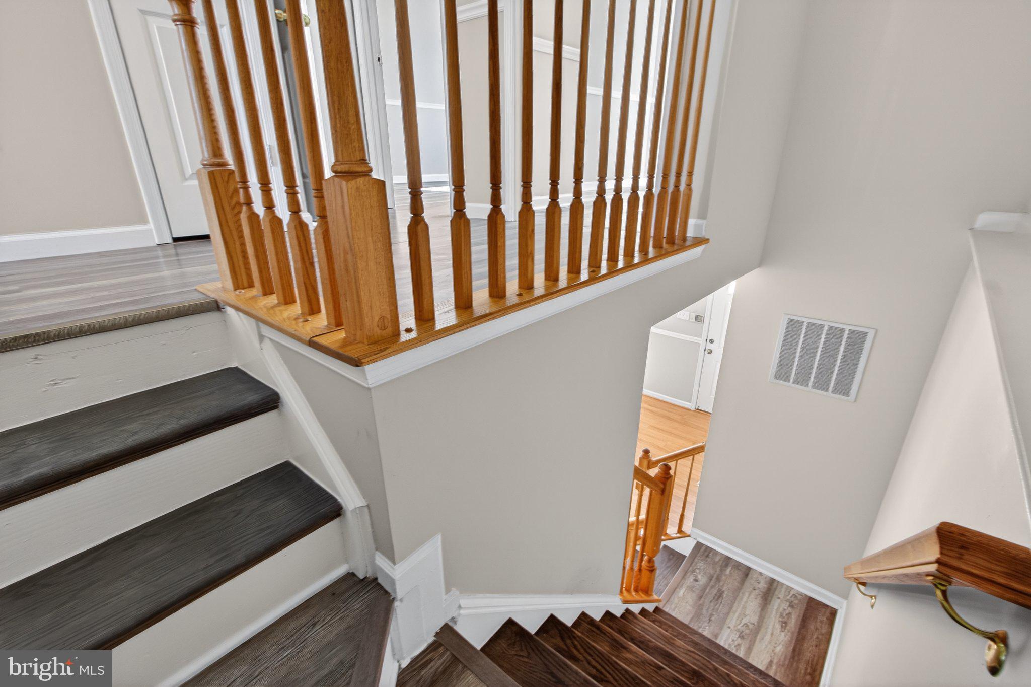 9963 Sherwood Farm Road Owings Mills, MD 21117 - Photo 11 of 48 a view of entryway with wooden floor and stairs