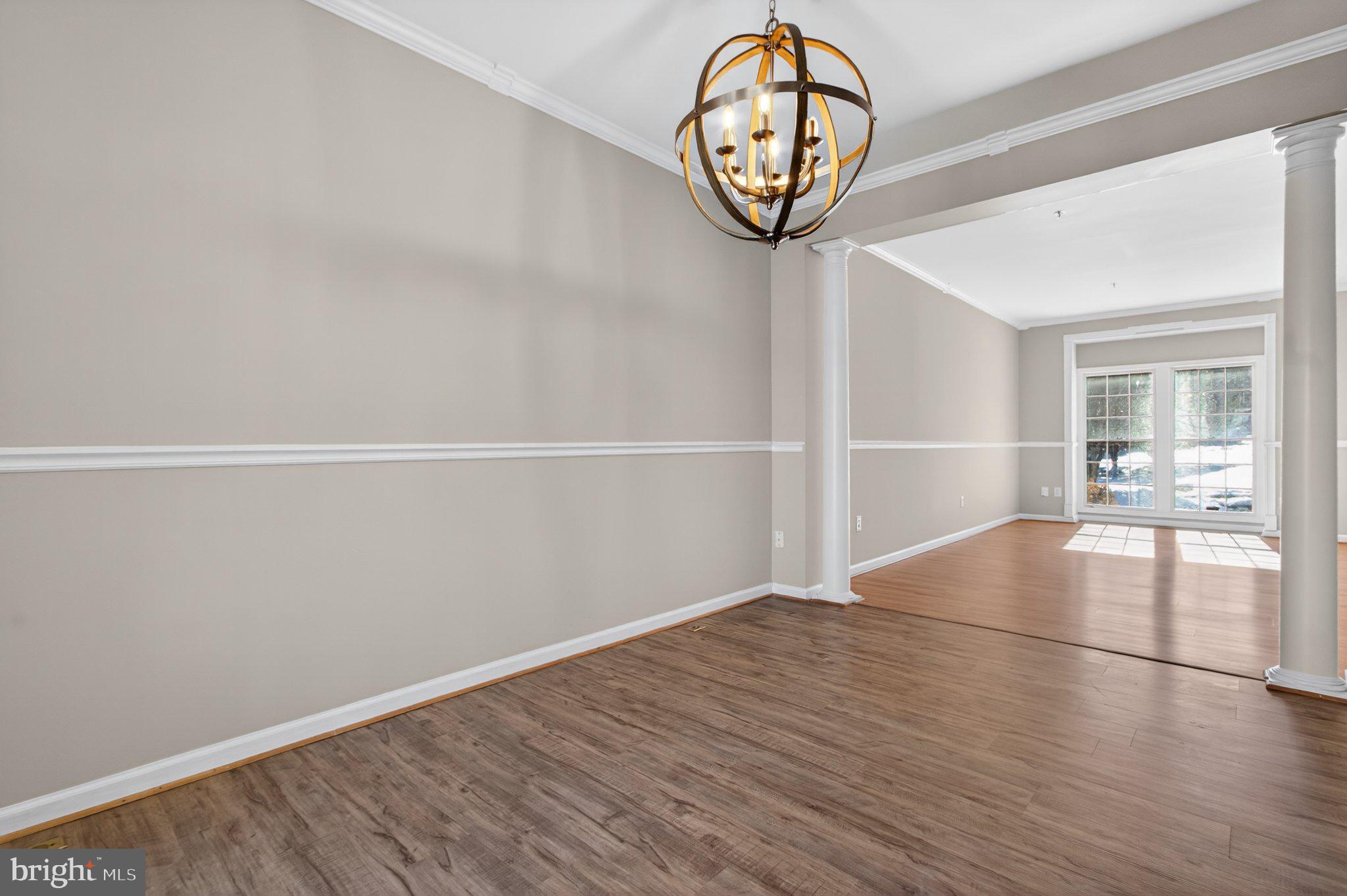 9963 Sherwood Farm Road Owings Mills, MD 21117 - Photo 12 of 48 an empty room with wooden floor and door