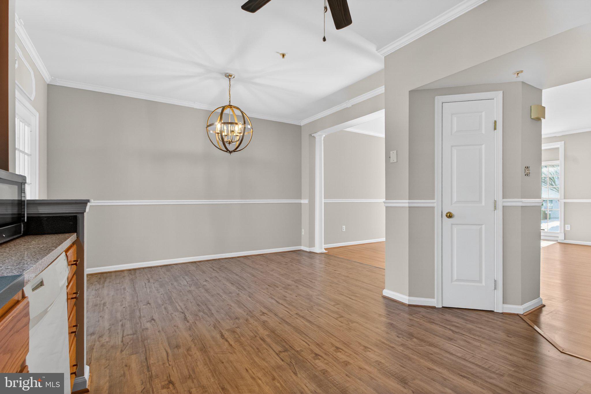 9963 Sherwood Farm Road Owings Mills, MD 21117 - Photo 14 of 48 a view of empty room with wooden floor and fan