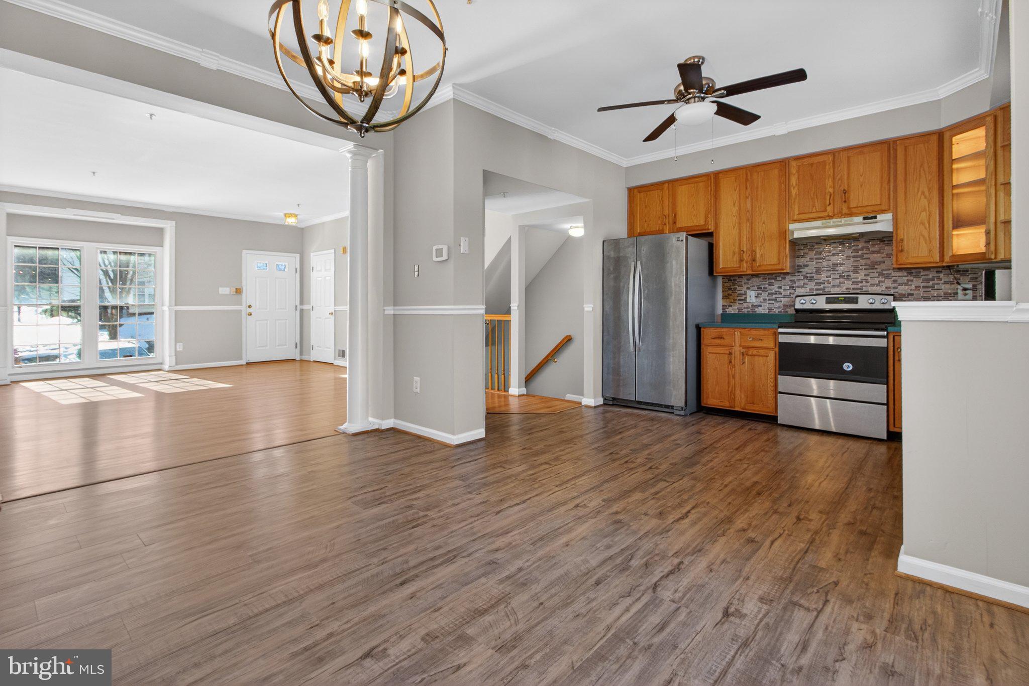 9963 Sherwood Farm Road Owings Mills, MD 21117 - Photo 16 of 48 a view of a kitchen with refrigerator stove and wooden floor