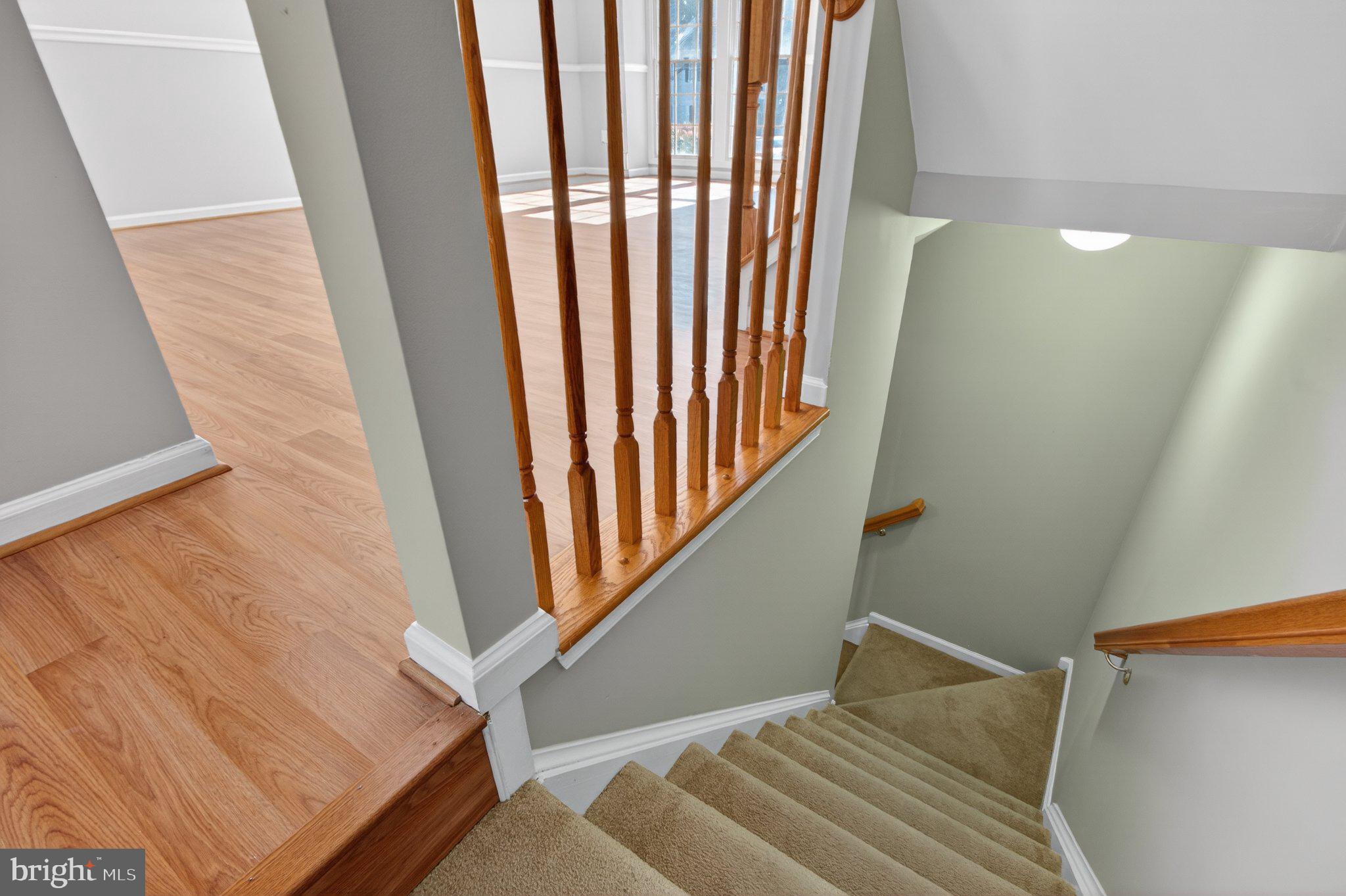 9963 Sherwood Farm Road Owings Mills, MD 21117 - Photo 22 of 48 a view of staircase with white walls and a window