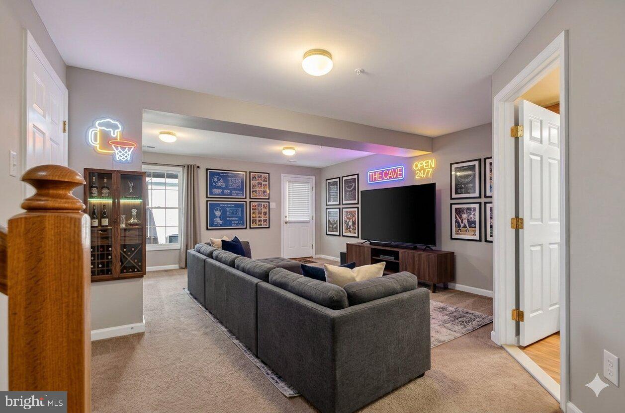 9963 Sherwood Farm Road Owings Mills, MD 21117 - Photo 28 of 48 a living room with furniture and a flat screen tv