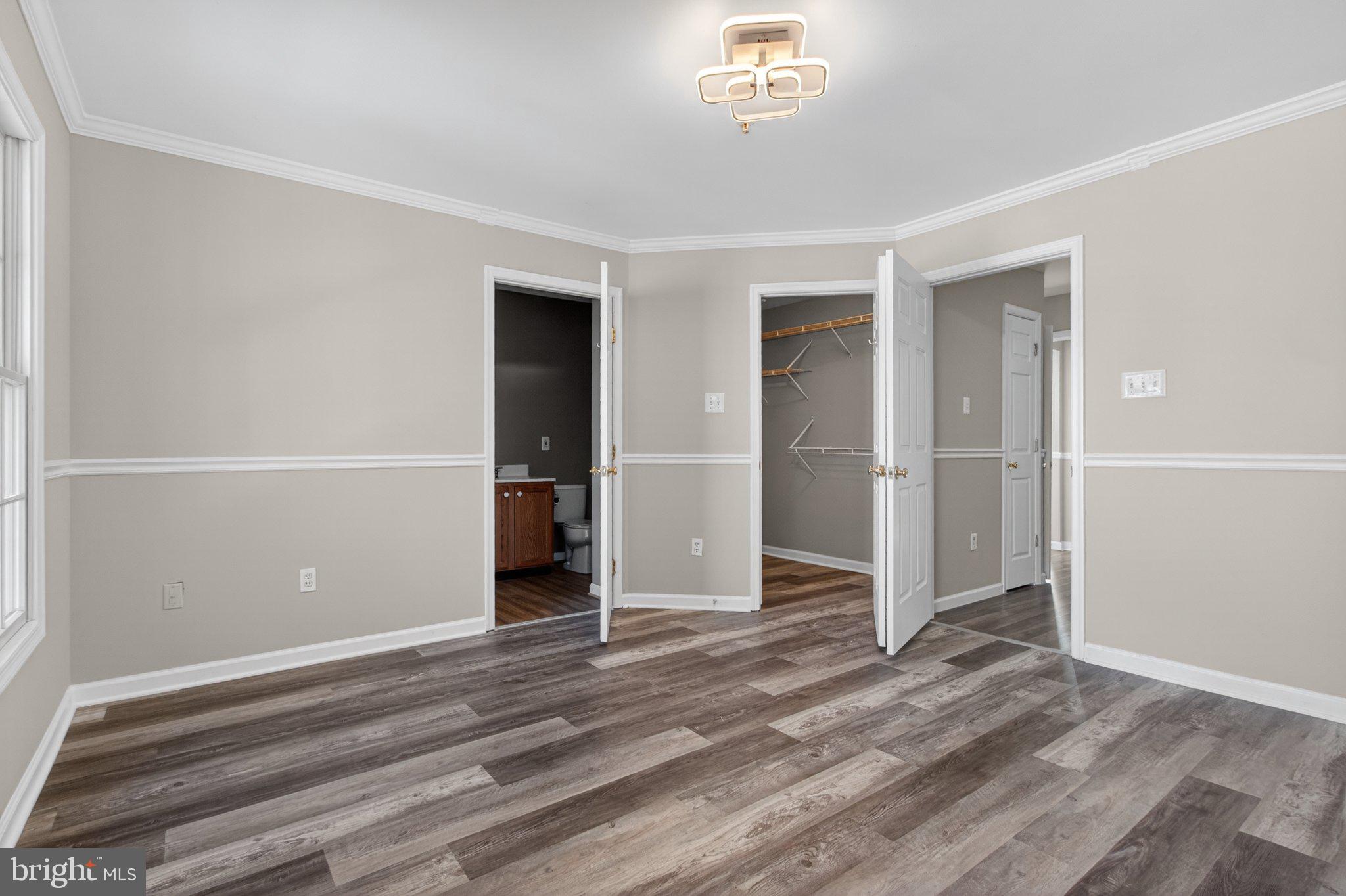 9963 Sherwood Farm Road Owings Mills, MD 21117 - Photo 33 of 48 an empty room with wooden floor closet and windows