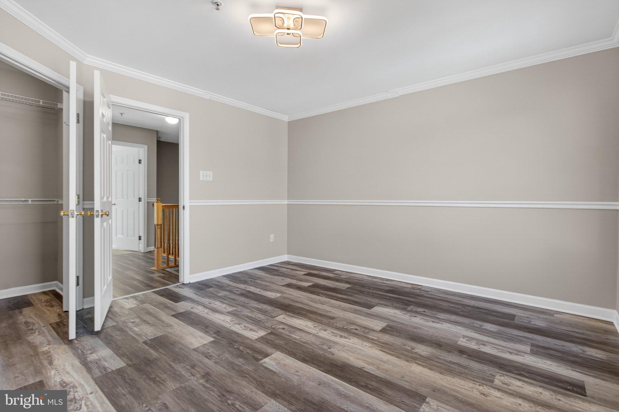 9963 Sherwood Farm Road Owings Mills, MD 21117 - Photo 34 of 48 a view of a room with wooden floor