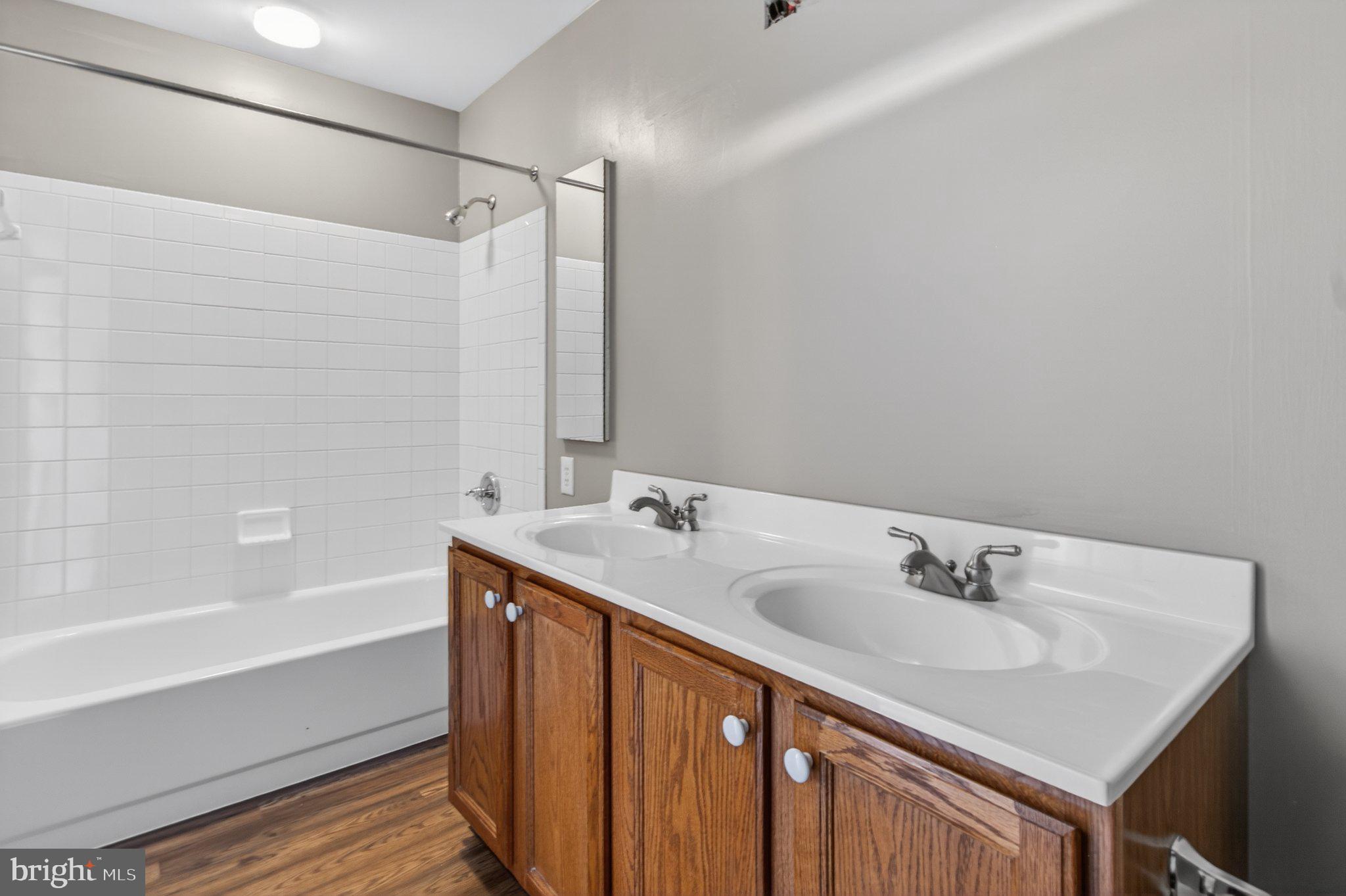 9963 Sherwood Farm Road Owings Mills, MD 21117 - Photo 39 of 48 a bathroom with a sink and a bathtub