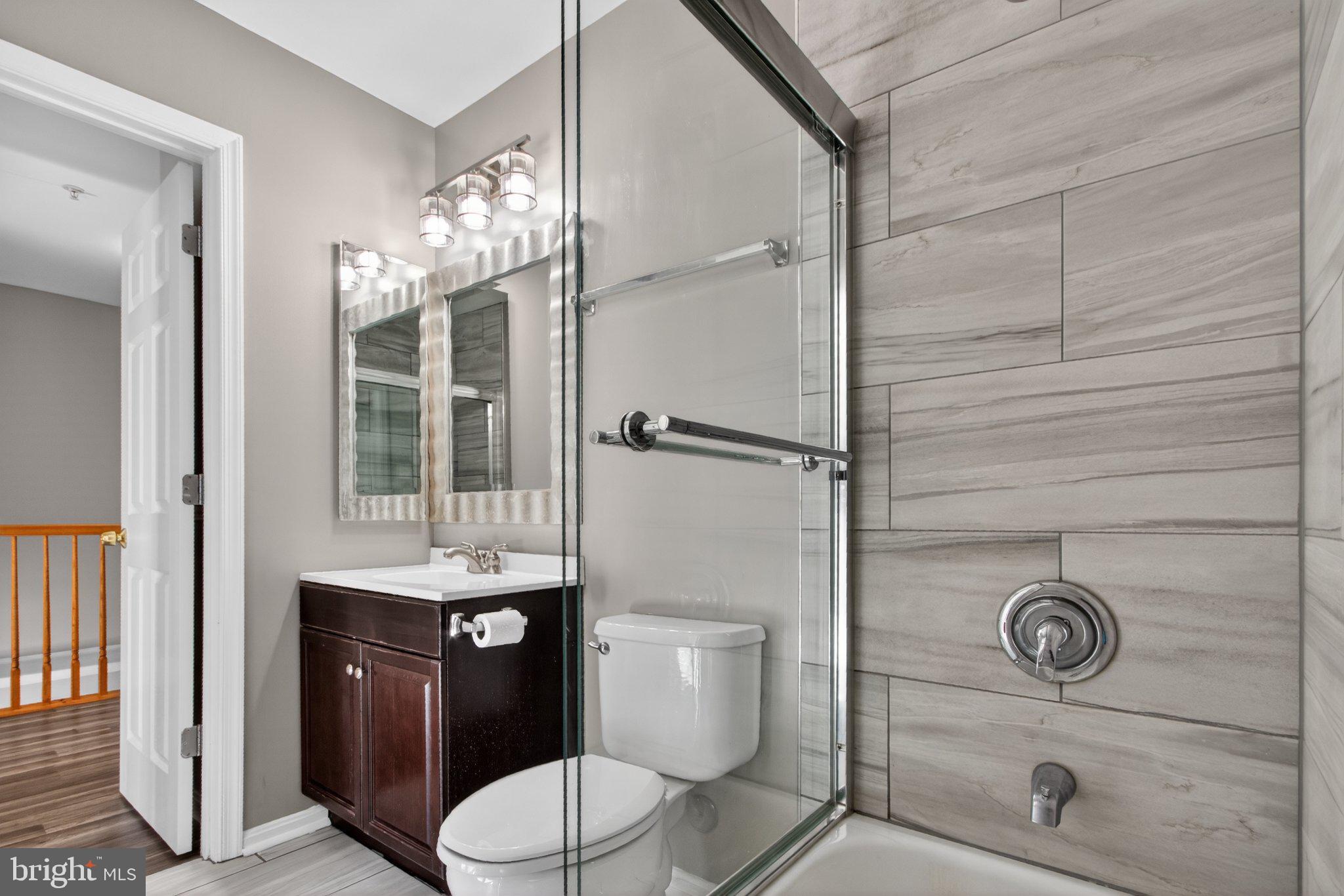 9963 Sherwood Farm Road Owings Mills, MD 21117 - Photo 43 of 48 a bathroom with a toilet and a shower