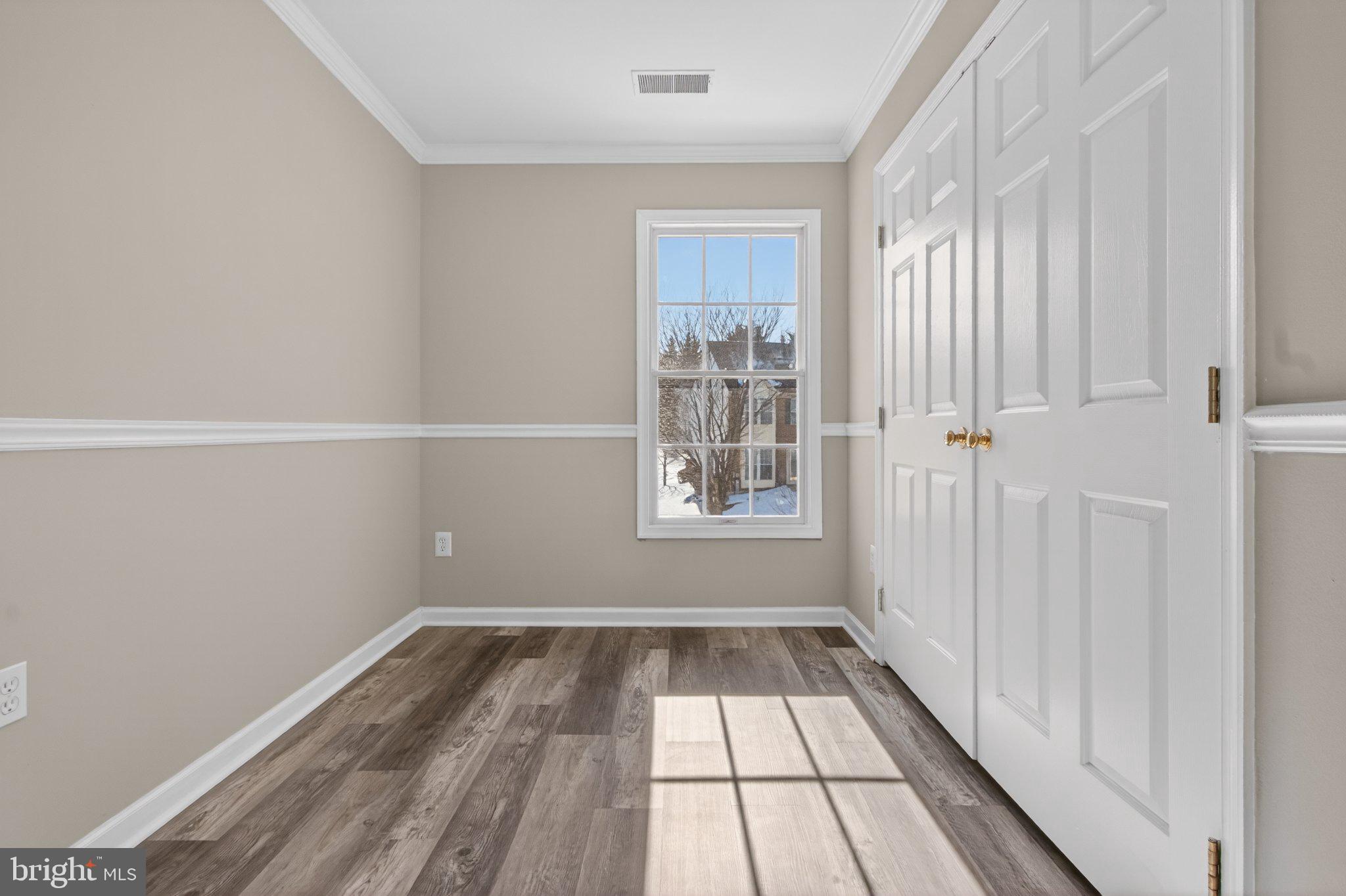 9963 Sherwood Farm Road Owings Mills, MD 21117 - Photo 46 of 48 a view of a room with wooden floor and a window