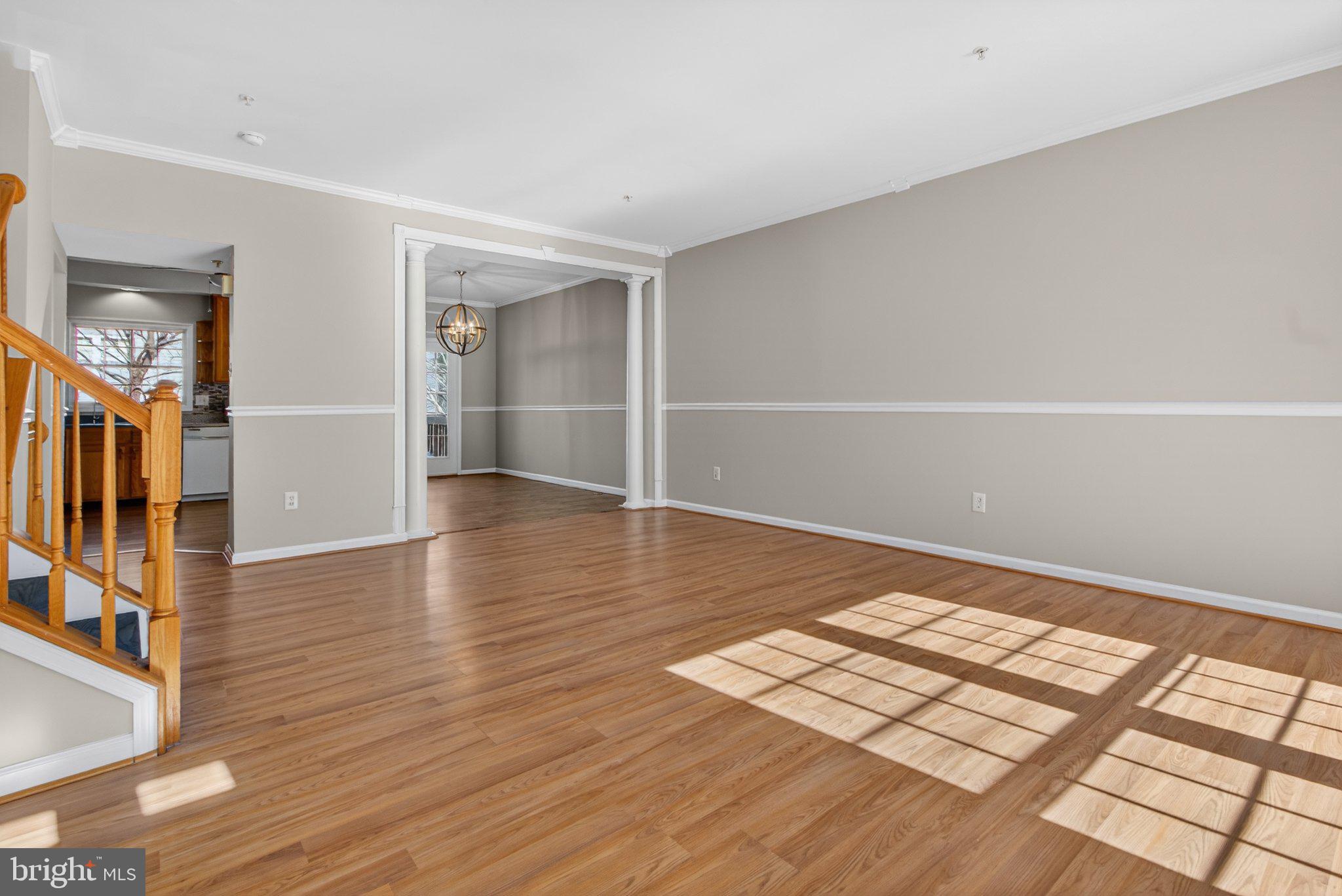 9963 Sherwood Farm Road Owings Mills, MD 21117 - Photo 5 of 48 wooden floor in an empty room with a window