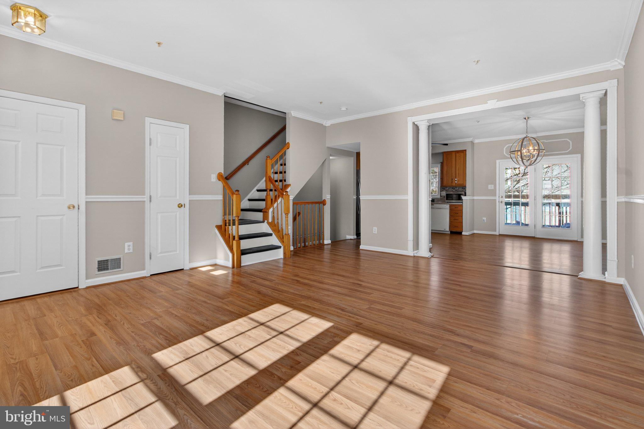 9963 Sherwood Farm Road Owings Mills, MD 21117 - Photo 6 of 48 a view of a livingroom with wooden floor and stairs