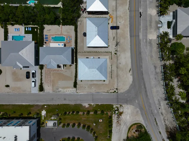 an aerial view of a house with swimming pool