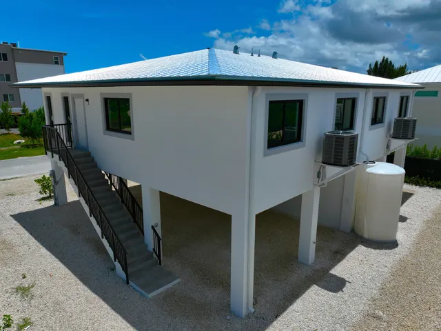 a front view of a house with stairs