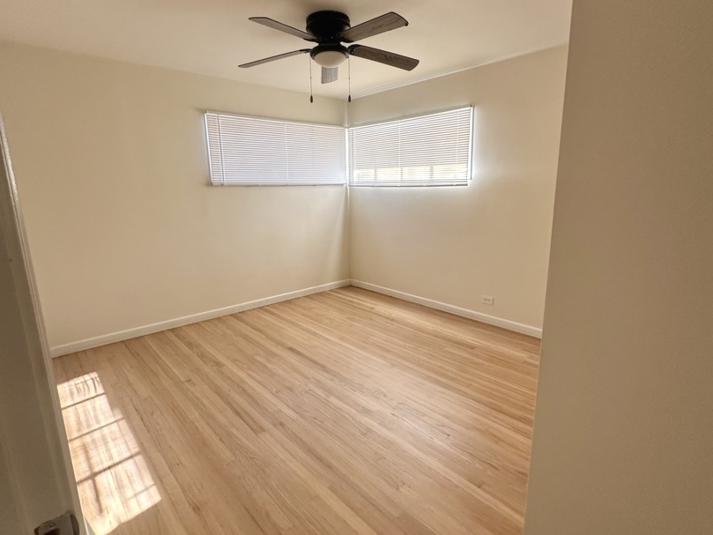 2156 Downey Road Homewood, IL 60430 - Photo 11 of 18 an empty room with a window and a ceiling fan