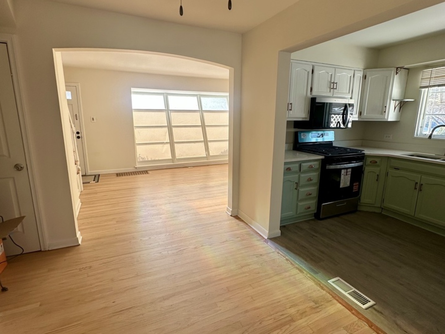 2156 Downey Road Homewood, IL 60430 - Photo 12 of 18 a kitchen with stainless steel appliances granite countertop a stove a sink and a refrigerator