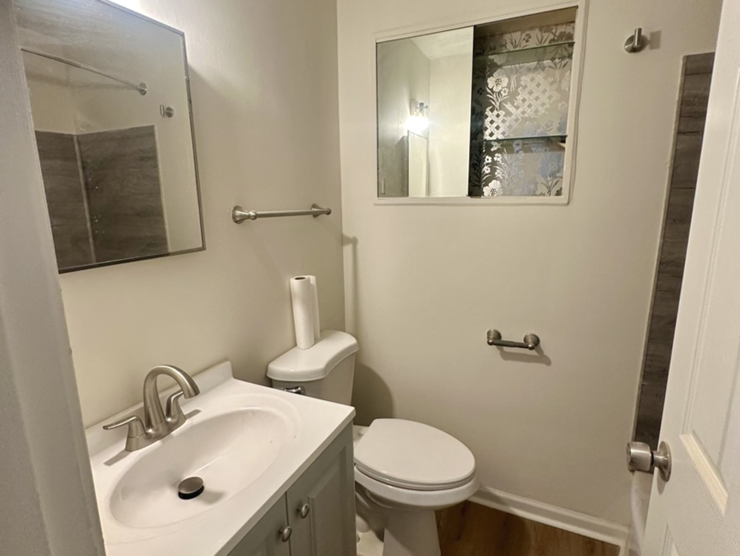 2156 Downey Road Homewood, IL 60430 - Photo 16 of 18 a bathroom with a sink mirror and toilet