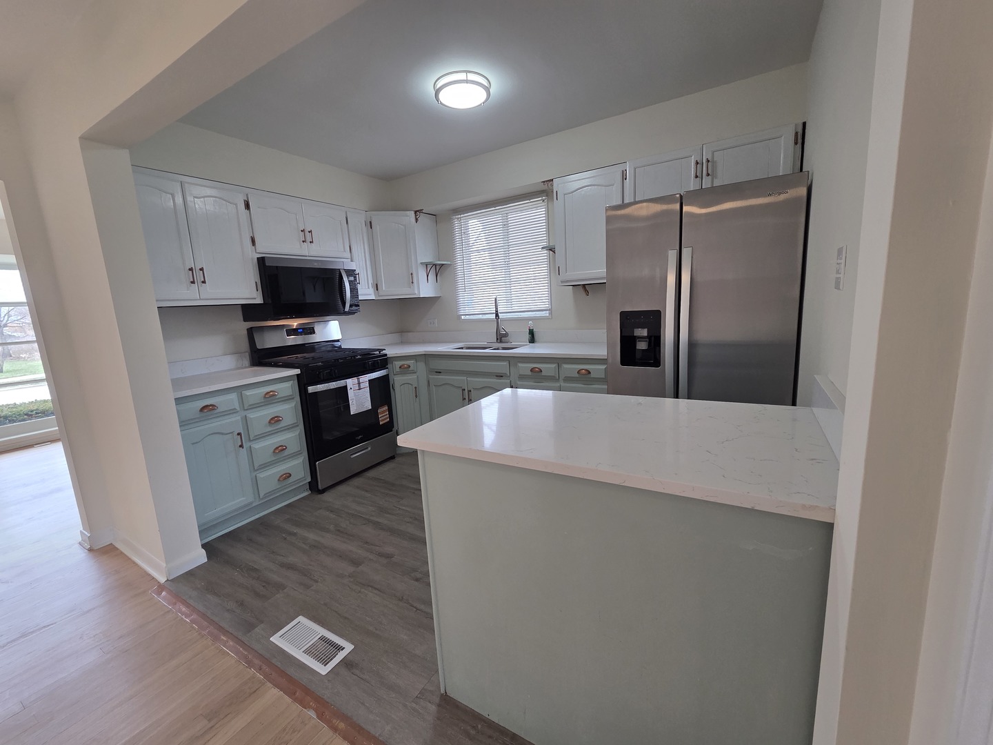2156 Downey Road Homewood, IL 60430 - Photo 2 of 17 a kitchen with stainless steel appliances a refrigerator stove microwave and sink