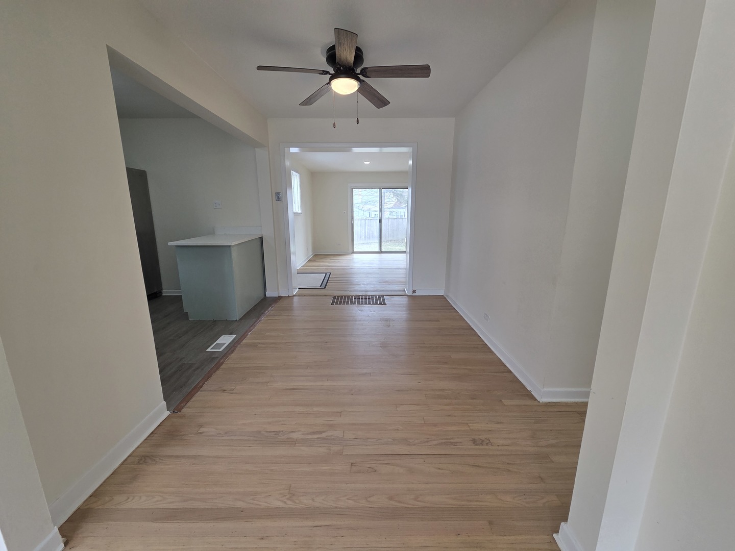 2156 Downey Road Homewood, IL 60430 - Photo 4 of 17 wooden floor in an empty room with a window