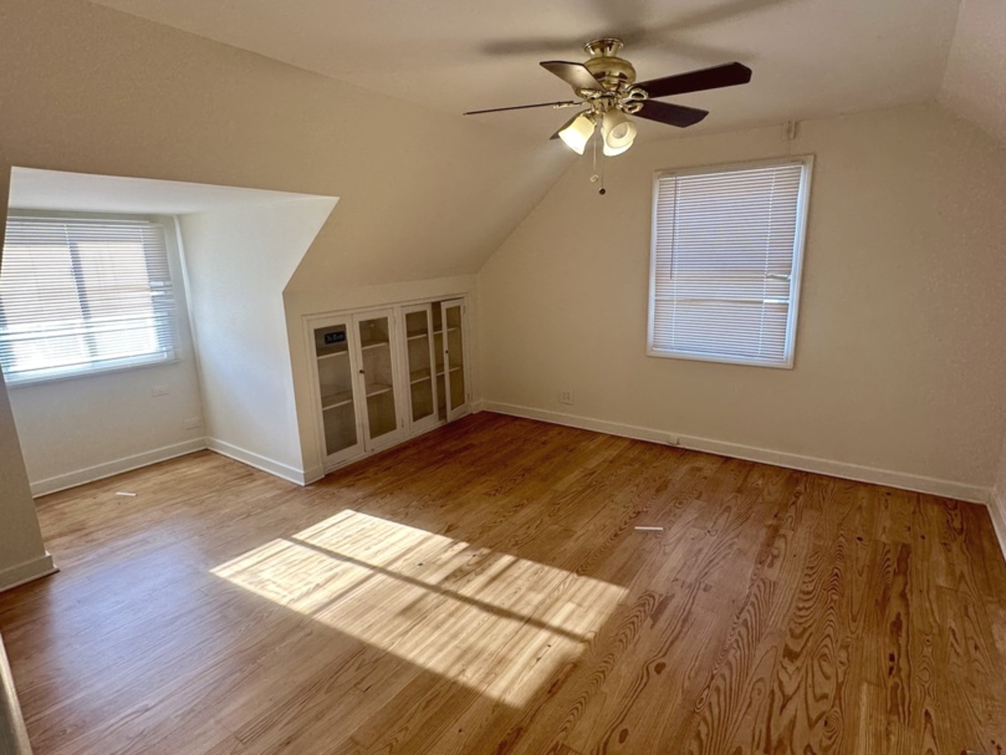 2156 Downey Road Homewood, IL 60430 - Photo 7 of 18 a view of an empty room with window and wooden floor