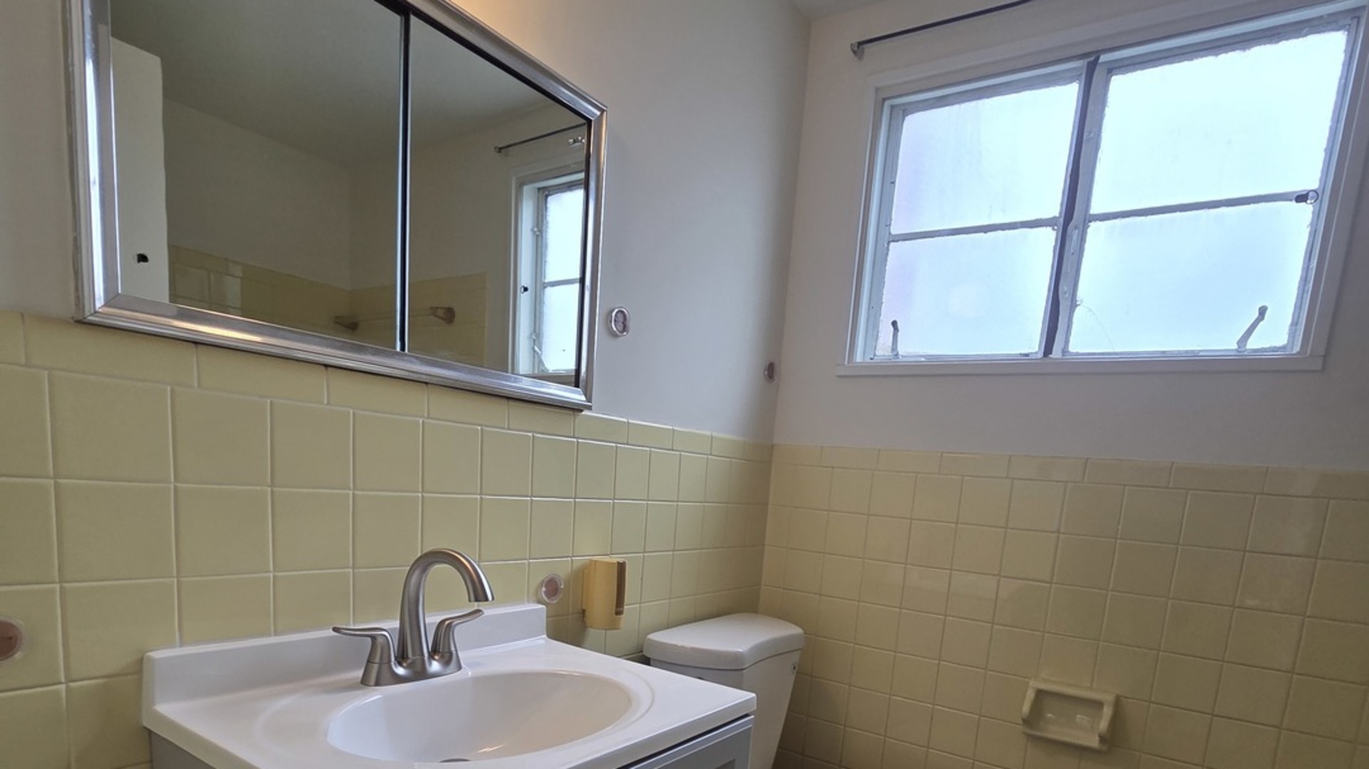 2156 Downey Road Homewood, IL 60430 - Photo 10 of 17 a bathroom with a sink and mirror