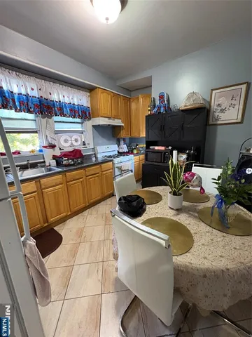 a kitchen with a sink a stove and lots of counter space