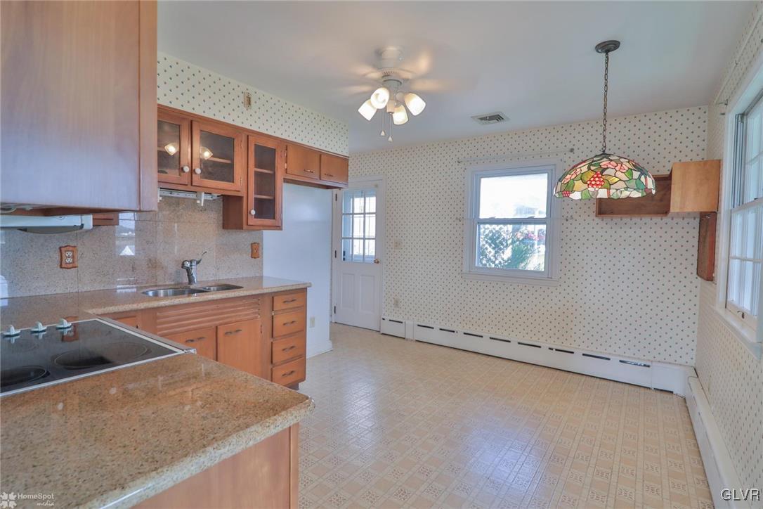 403 Keystone Avenue Emmaus, PA 18049 - Photo 11 of 29 a kitchen with stainless steel appliances granite countertop a sink a stove and a granite counter tops