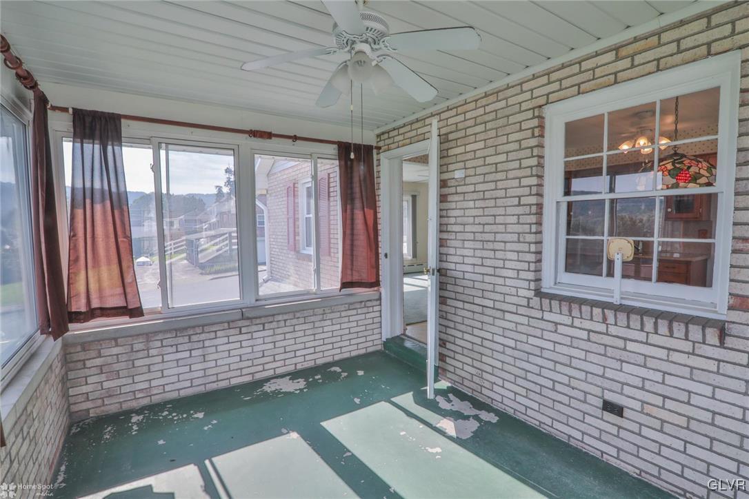 403 Keystone Avenue Emmaus, PA 18049 - Photo 13 of 29 a view of a porch with wooden floor and fence