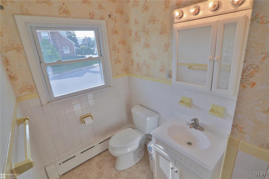 403 Keystone Avenue Emmaus, PA 18049 - Photo 21 of 29 a white toilet sitting next to a bathroom sink