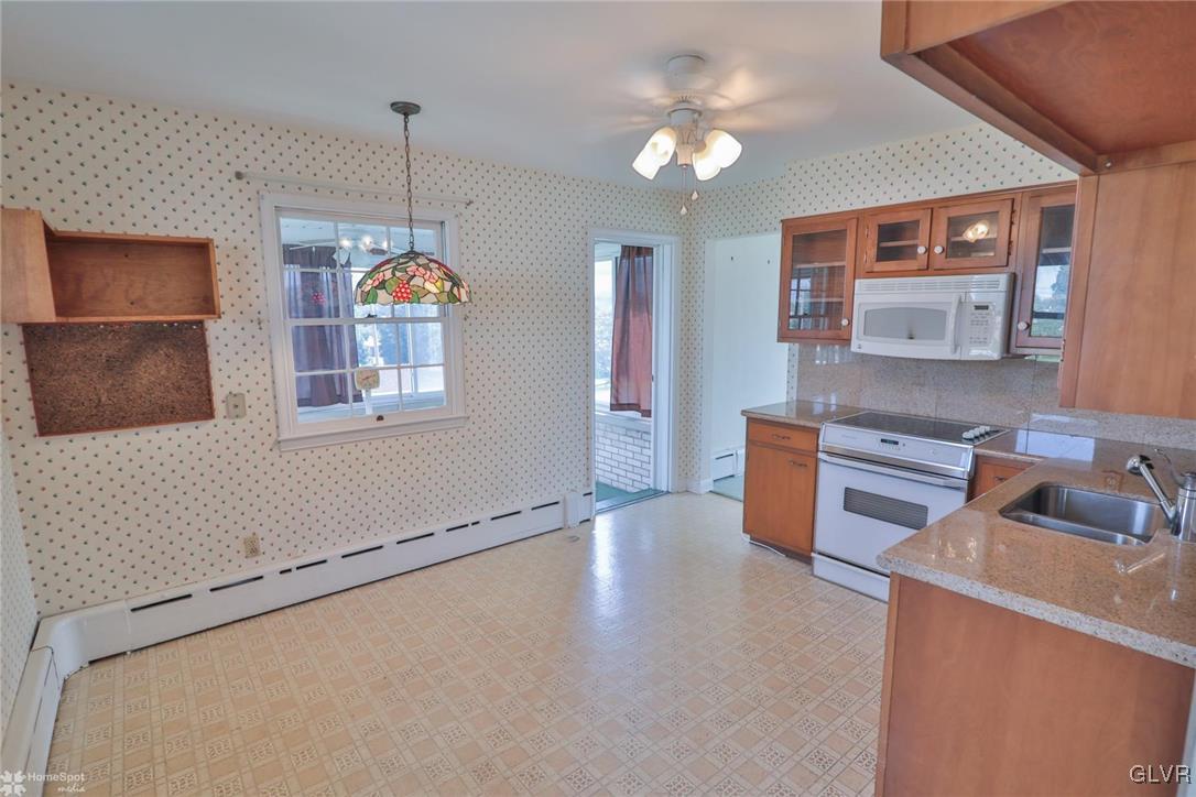 403 Keystone Avenue Emmaus, PA 18049 - Photo 9 of 29 a kitchen that has a lot of cabinets and appliances