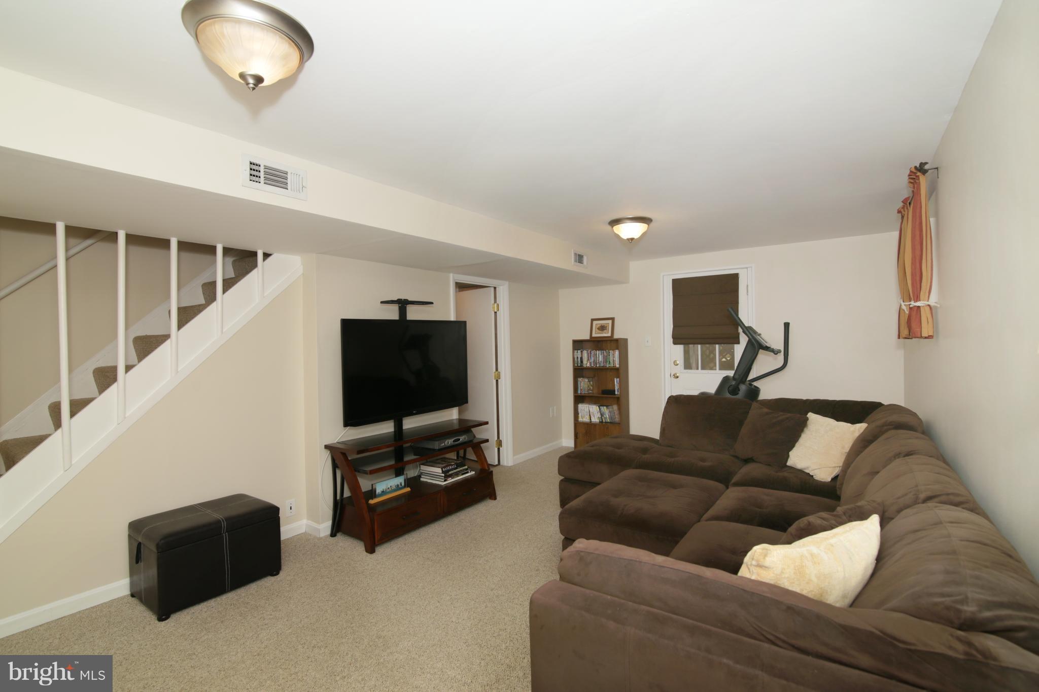 6710 Huntsman Boulevard Springfield, VA 22152 - Photo 22 of 30 Recreation Room with Walkout to Backyard