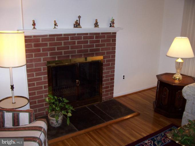 5636 Heming Avenue Springfield, VA 22151 - Photo 2 of 30 a living room with furniture and a fireplace