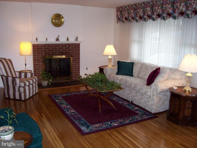 5636 Heming Avenue Springfield, VA 22151 - Photo 15 of 30 a living room with furniture and a fireplace