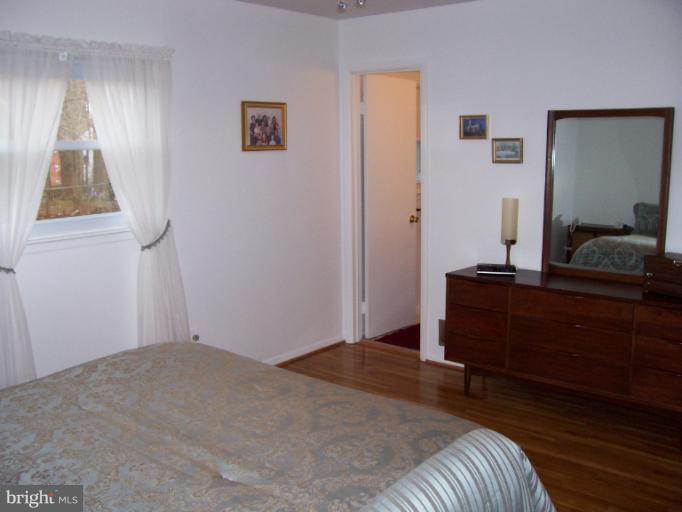 5636 Heming Avenue Springfield, VA 22151 - Photo 18 of 30 a bedroom with a bed and a window