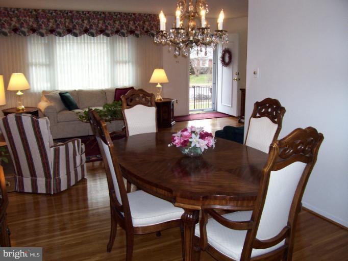 5636 Heming Avenue Springfield, VA 22151 - Photo 22 of 30 a view of a dining room with furniture and chandelier