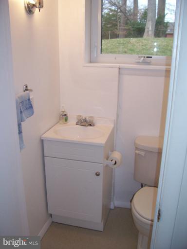 5636 Heming Avenue Springfield, VA 22151 - Photo 8 of 30 a bathroom with a toilet sink and mirror