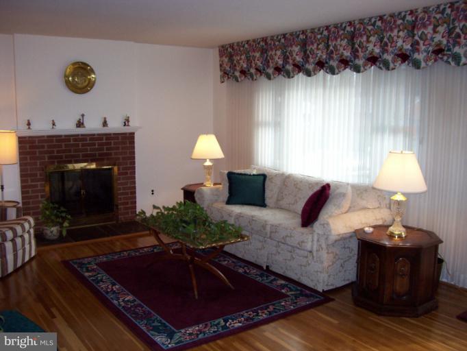 5636 Heming Avenue Springfield, VA 22151 - Photo 9 of 30 a living room with furniture and a fireplace