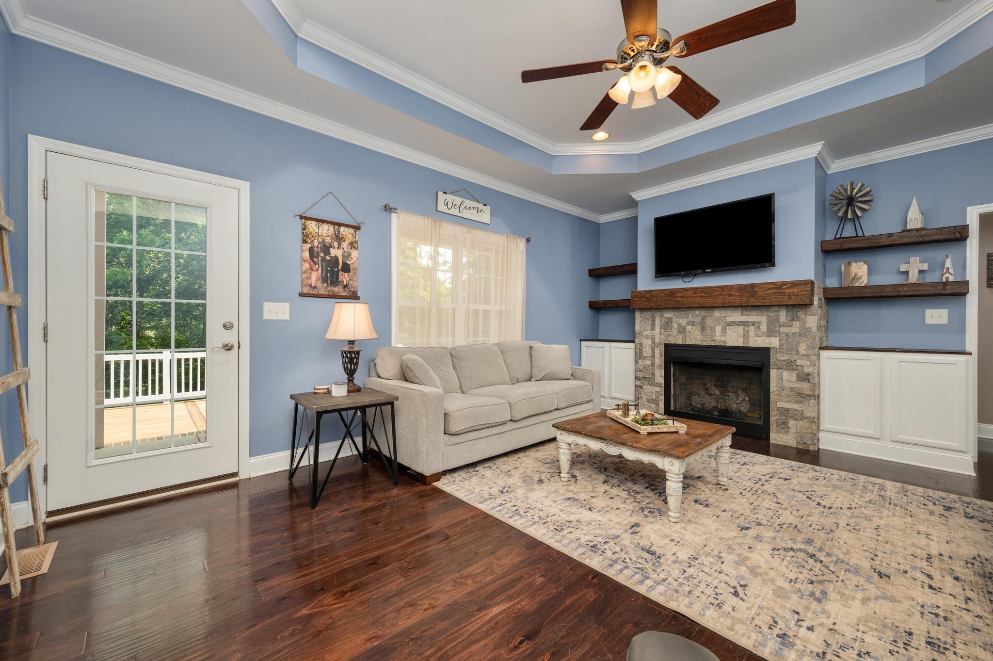 16 Shasteen Ridge Road Lynchburg, TN 37352 - Photo 13 of 55 a living room with furniture and a fireplace