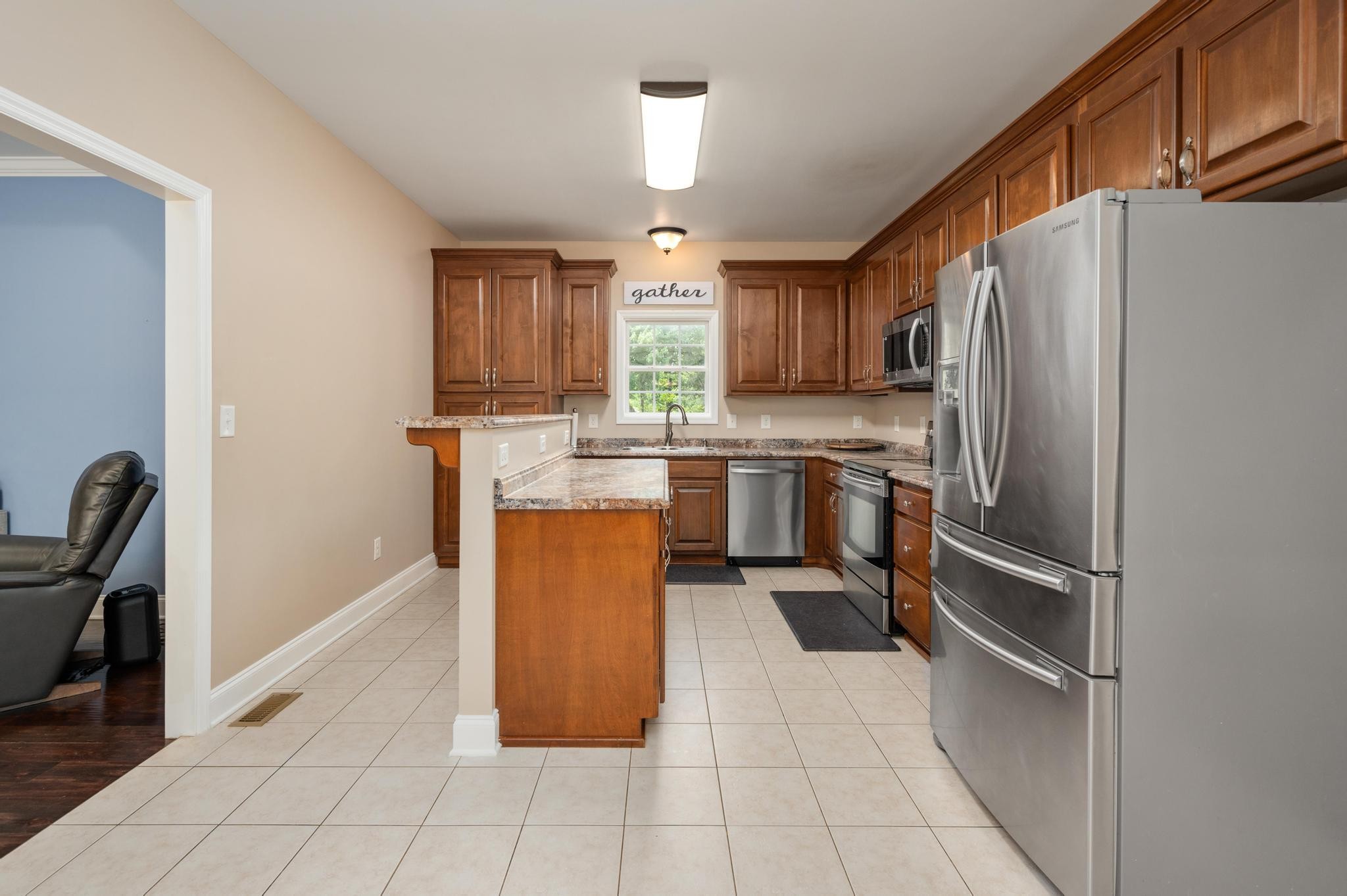 16 Shasteen Ridge Road Lynchburg, TN 37352 - Photo 20 of 55 a kitchen with stainless steel appliances granite countertop a refrigerator and a stove top oven