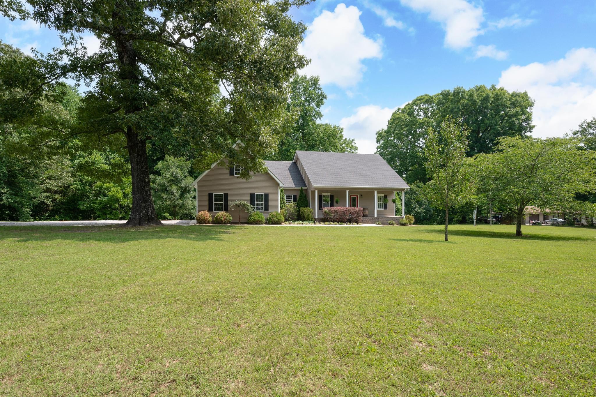 16 Shasteen Ridge Road Lynchburg, TN 37352 - Photo 7 of 55 a front view of a house with a garden