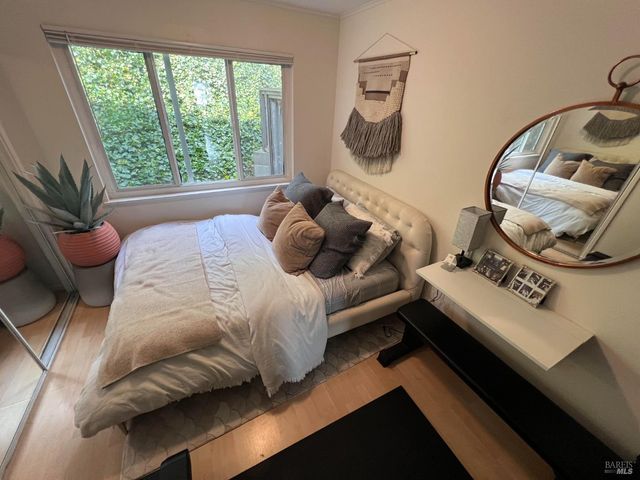 a bedroom with a bed and window