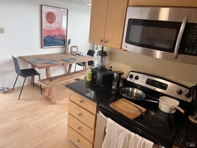 a kitchen with a stove and a microwave