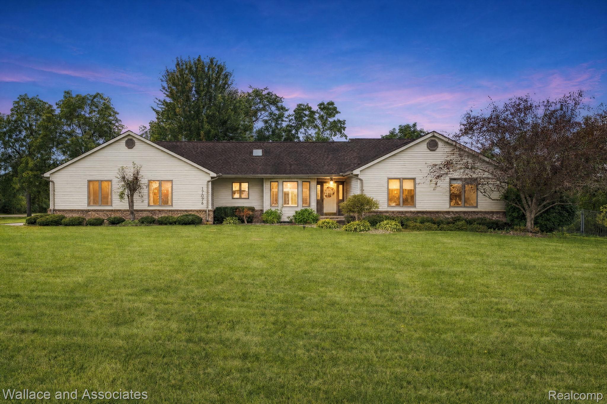 17076 27 Mile Road Ray, MI 48096 - Photo 1 of 63 Ranch-style residence featuring light-colored siding, a dark roof, and multiple windows across the facade