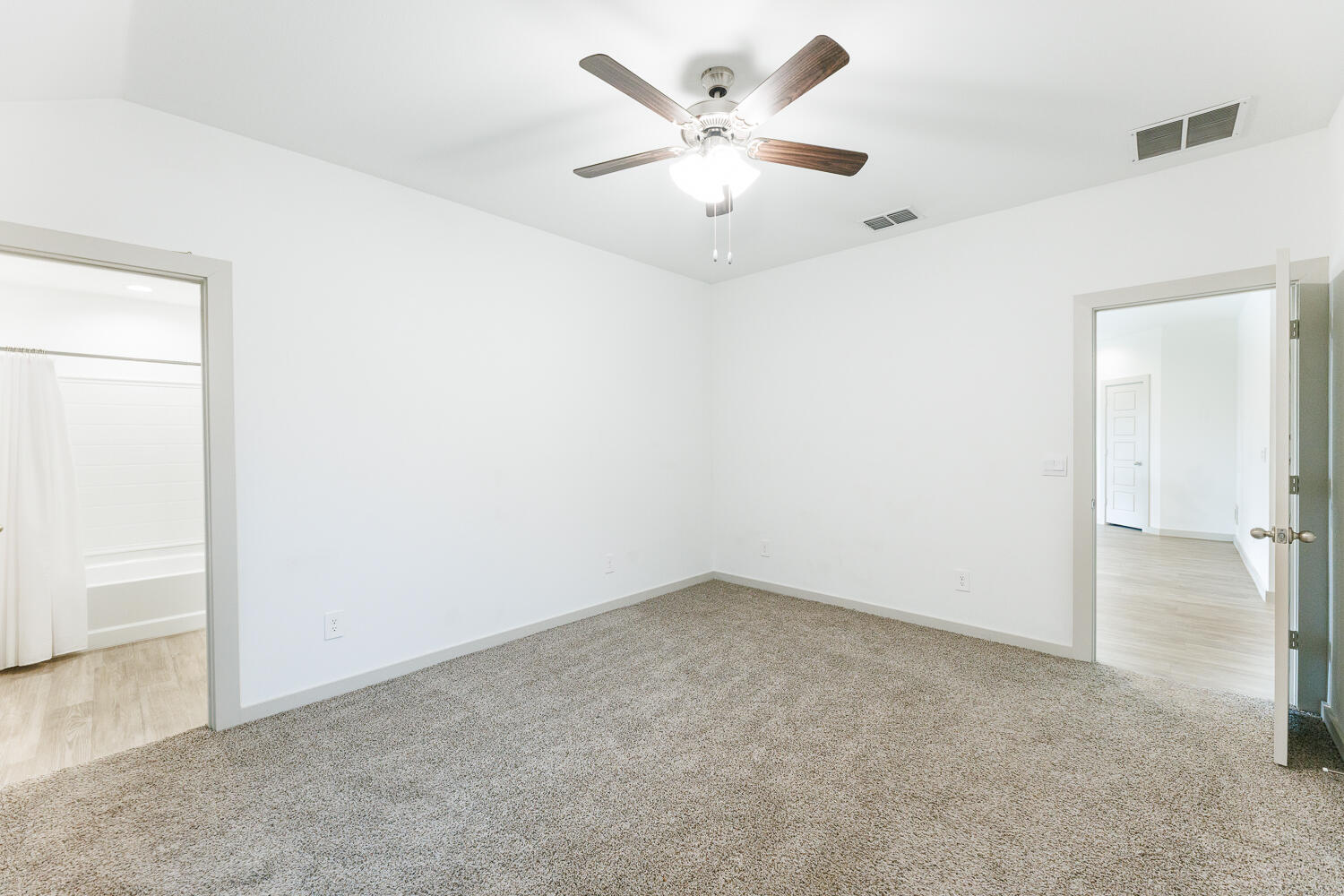 2305 150th Street Lubbock, TX 79423 - Photo 20 of 39 an empty room with a ceiling fan and a window