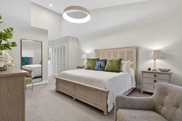 a bedroom with a bed and a table