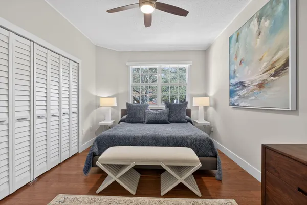 a view of a hallway to a livingroom with furniture