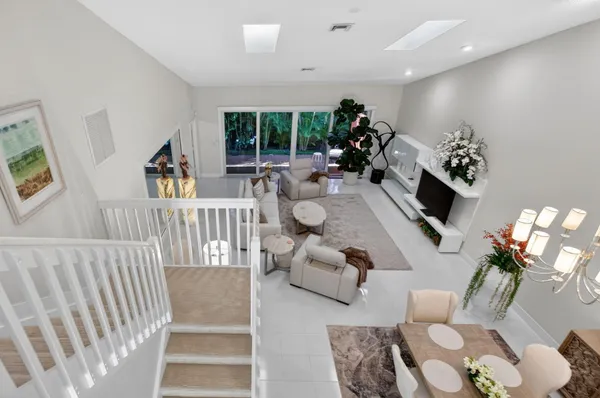 a view of a house with a porch and furniture