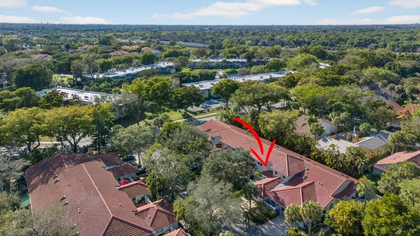 a view of a chairs and table in backyard