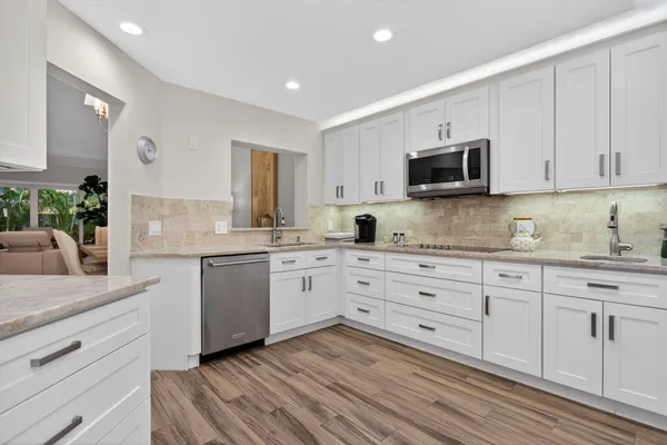 a view of kitchen with furniture and wooden floor