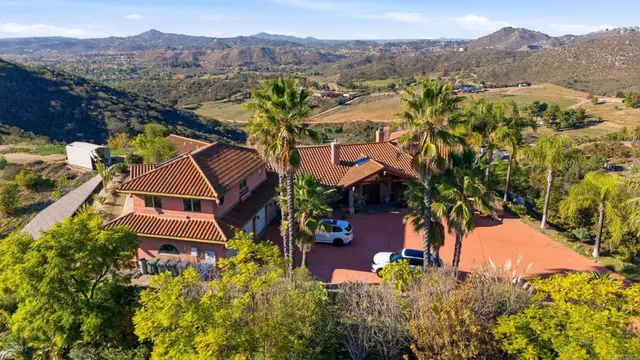 an aerial view of a house with a garden
