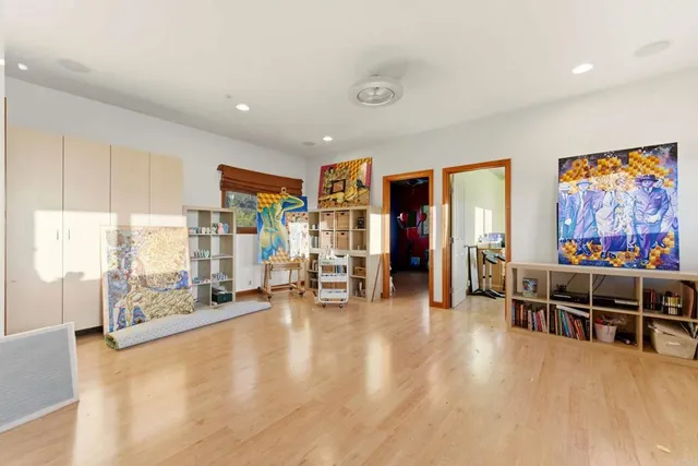 a bedroom with a bed and balcony view
